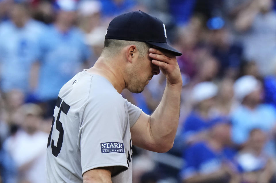 New York Yankees pitcher Carlos Rodon reacts after giving up a three-run home run to Toronto Blue Jays' George Springer during the second inning of a baseball game Thursday, June 27, 2024, in Toronto. (Frank Gunn/The Canadian Press via AP)