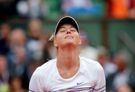 FILE PHOTO - Maria Sharapova of Russia celebrates after beating Samantha Stosur of Australia during their women's singles match at the French Open tennis tournament at the Roland Garros stadium in Paris, France, May 29, 2015. REUTERS/Jean-Paul Pelissier/File Photo