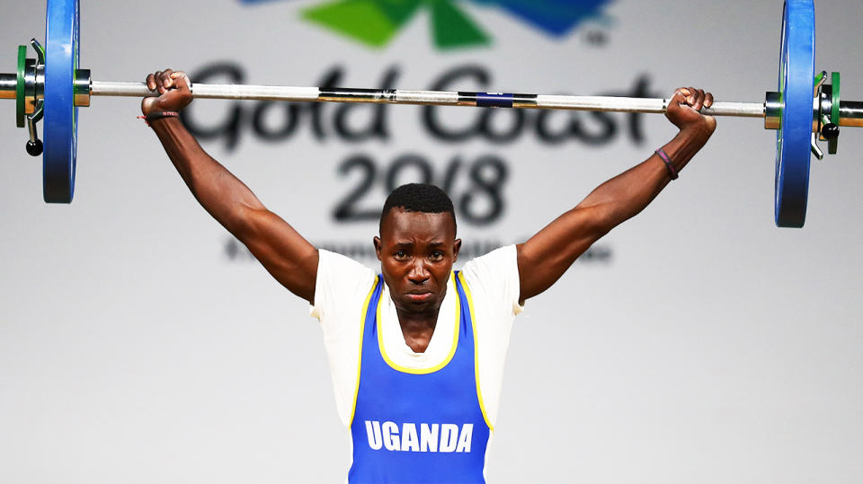 Julius Ssekitoleko (pictured) lifting during the Commonwealth Games.