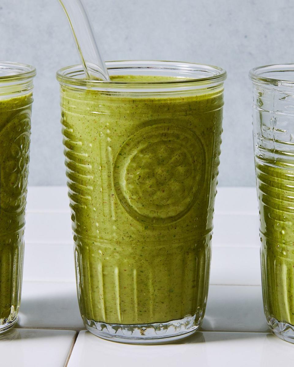 green smoothie blended in a glass