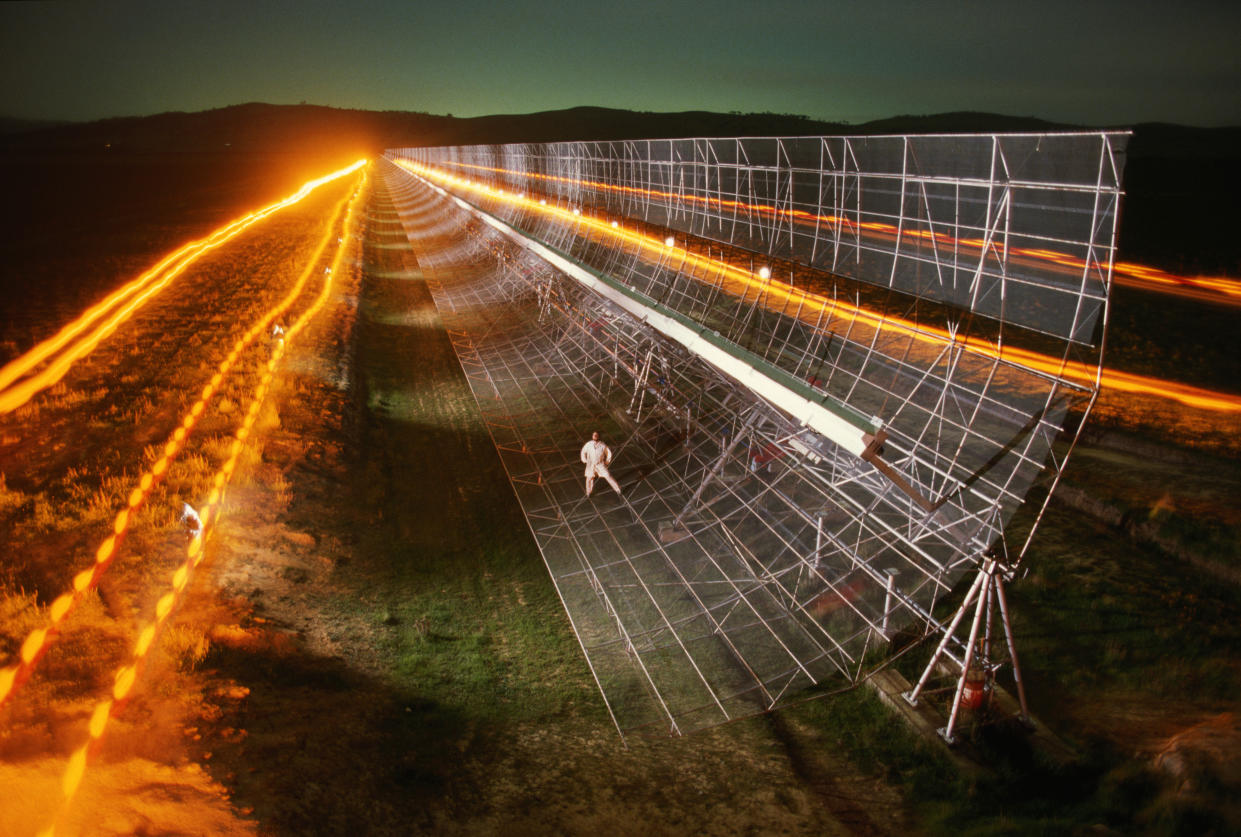 Officer-in-charge Duncan Campbell-Wilson stands on the mile-long Molonglo Observatory Synthesis Telescope, which is located in southeastern Australia.