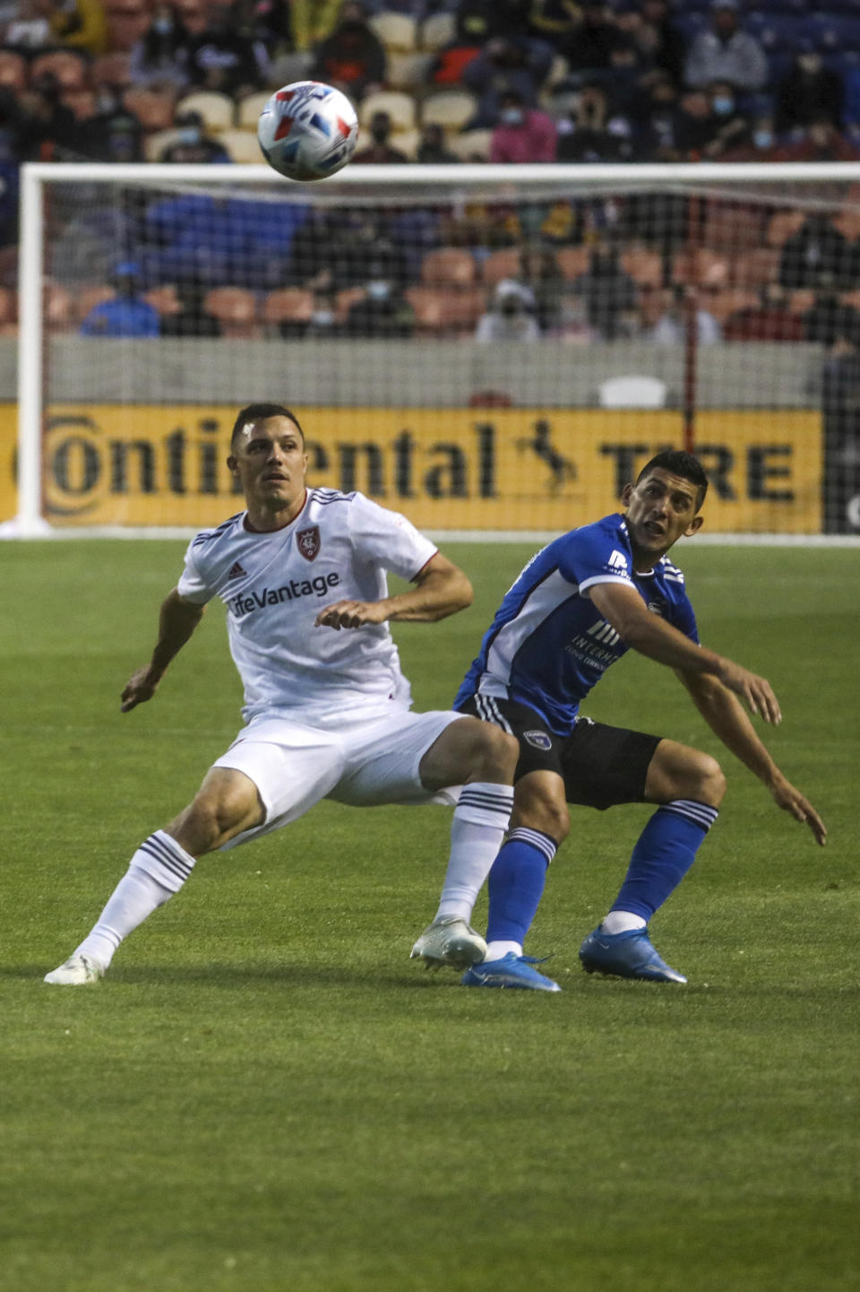 Real Salt Lake defender Donny Toia (4) fights for the ball with San Jose Earthquake midfielder Cristian Espinoza (10) during an MLS soccer match at Rio Tinto Stadium in Sandy, Utah, Friday, May 7, 2021. (Annie Barker/The Deseret News via AP)