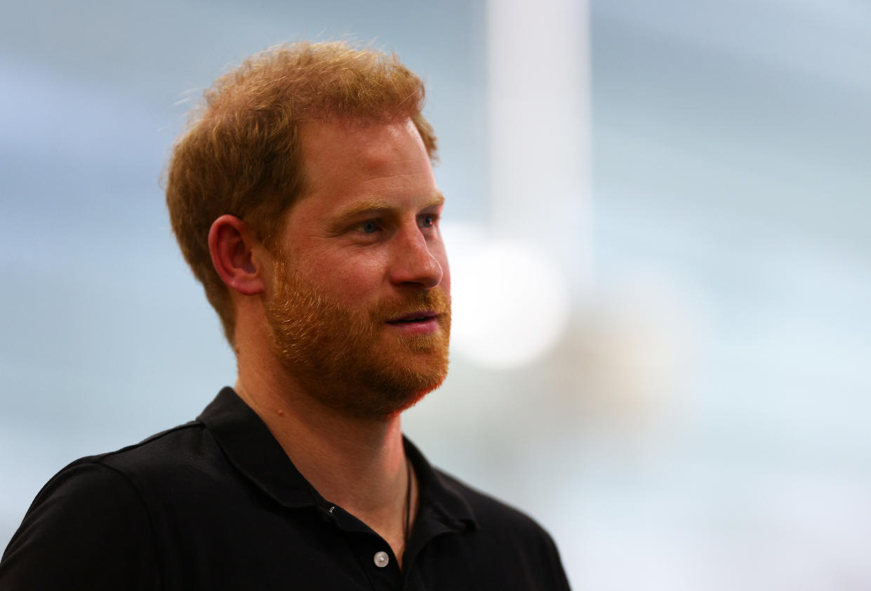 THE HAGUE, NETHERLANDS - APRIL 19: Prince Harry, Duke of Sussex looks on  during the medal ceremony for the Women's 50m Breaststroke ISD during the Swimming on day four of the Invictus Games The Hague 2020 at Zuiderpark on April 19, 2022 in The Hague, Netherlands. (Photo by Dean Mouhtaropoulos/Getty Images for Invictus Games The Hague 2020)