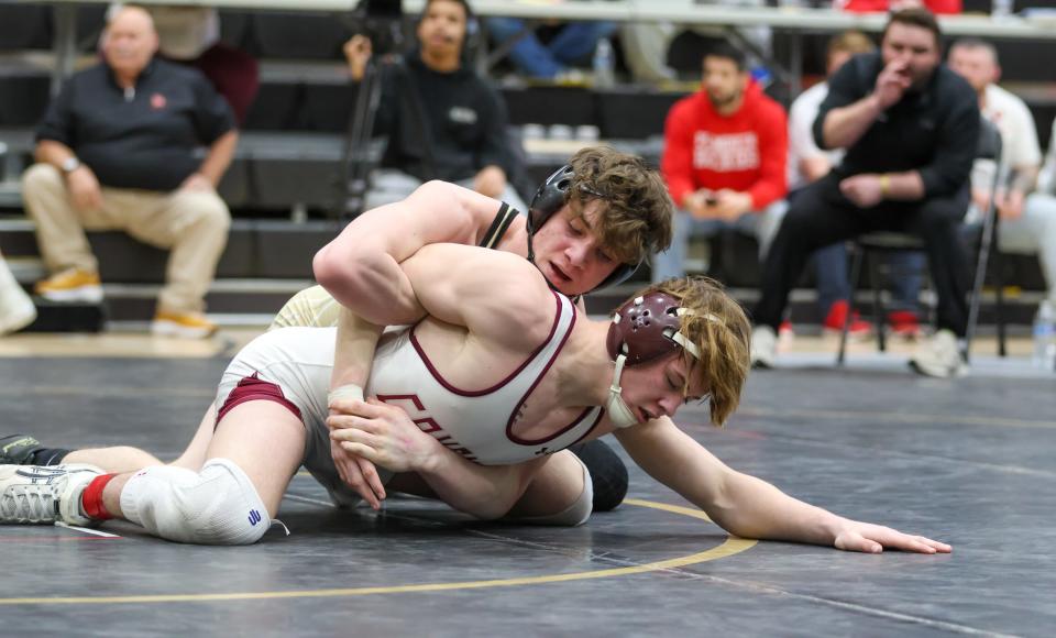 Bryce Denton of Penn wrestles Beau Brabender of Mishawaka in the final at 152lbs during the IHSAA Wrestling Regionals Saturday, Feb. 4, 2023 at Penn High School. Denton won.