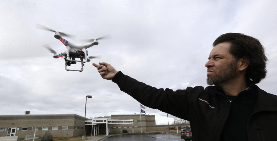 In this Feb. 13, 2014, photo, Jon McBride, who designs and builds drones with Digital Defense Surveillance, flies a training drone for members of the the Box Elder County Sheriff's Office search and rescue team, during a demonstration, in Brigham City, Utah. Law enforcement, government agencies and others are itching to use drones for everything from finding lost hikers to tracking shifting wildfires. But privacy watchdogs are urging state legislatures to step in and head off any potential privacy violations. That tension is on display as more than 35 states consider drone legislation this year, according to the National Conference of State Legislatures. The bills include ways to attract an industry that could generate billions and restrictions on drone use and data collection. (AP Photo/Rick Bowmer)