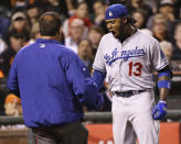 Los Angeles Dodgers' Hanley Ramirez reacts after being hit by a throw from San Francisco Giants' Ryan Vogelsong during the seventh inning of a baseball game on Wednesday, April 16, 2014, in San Francisco. (AP Photo/Marcio Jose Sanchez)