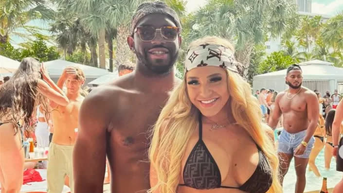 Christian Obumseli and Courtney Clenney in swimsuits at a pool party.