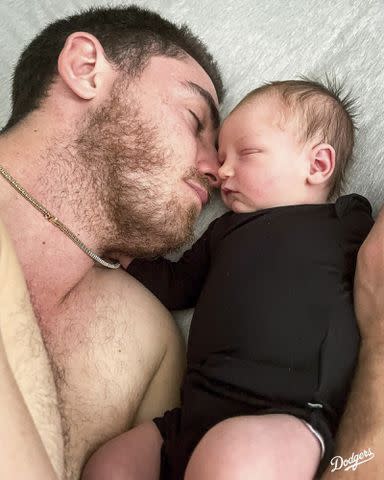 Los Angeles Dodgers/Instagram Cody Bellinger and daughter Caiden snuggle in bed.