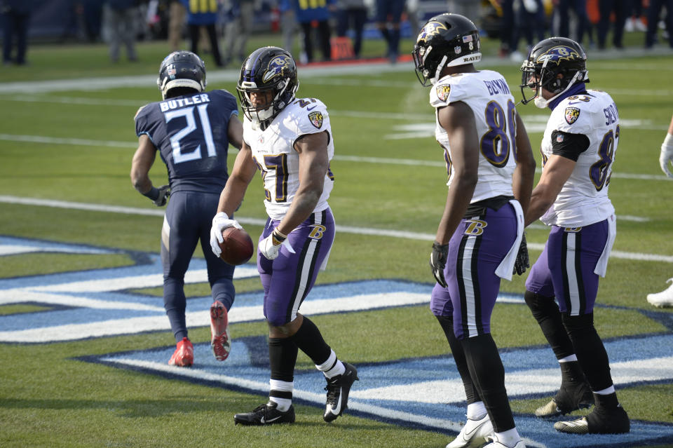 Baltimore Ravens running back J.K. Dobbins (27) celebrates after scoring a touchdown against the Tennessee Titans in the second half of an NFL wild-card playoff football game Sunday, Jan. 10, 2021, in Nashville, Tenn. (AP Photo/Mark Zaleski)