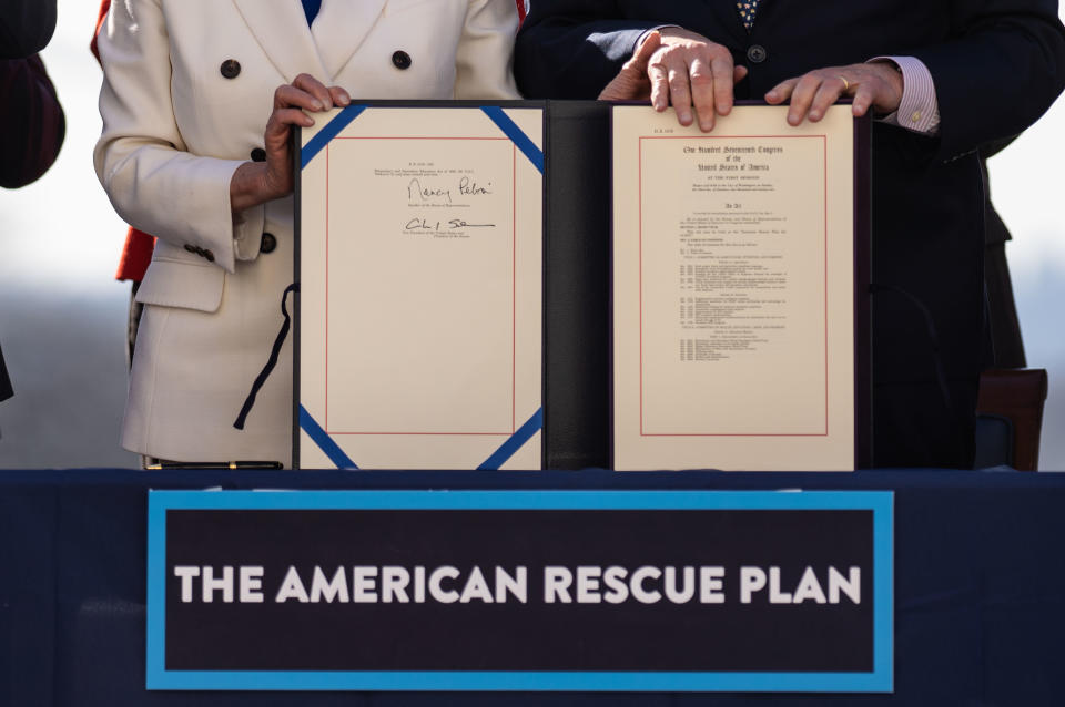 Speaker of the House Nancy Pelosi (D-CA) and Senate Majority Leader Chuck Schumer (D-NY) sign H.R. 1319 American Rescue Plan Act of 2021during a bill enrollment ceremony on Capitol Hill on Wednesday, March 10, 2021 in Washington, DC.  (Kent Nishimura/Los Angeles Times via Getty Images)