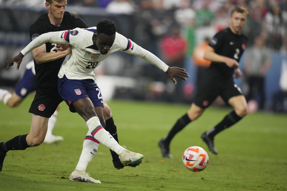 Folarin Balogun of the United States shoots to score against Canada during the first half of a CONCACAF Nations League final match Sunday, June 18, 2023, in Las Vegas. (AP Photo/John Locher)