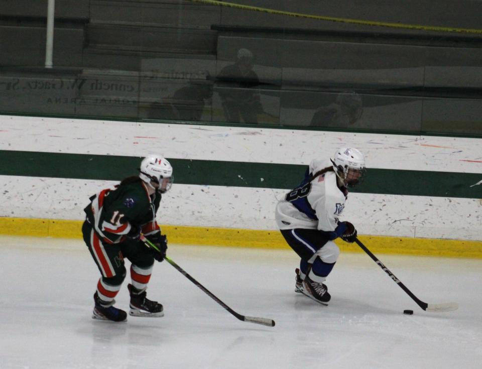 Rachel Simkewicz carries the puck down the ice in Leominster's game against Hopkinton on December 11, 2023.