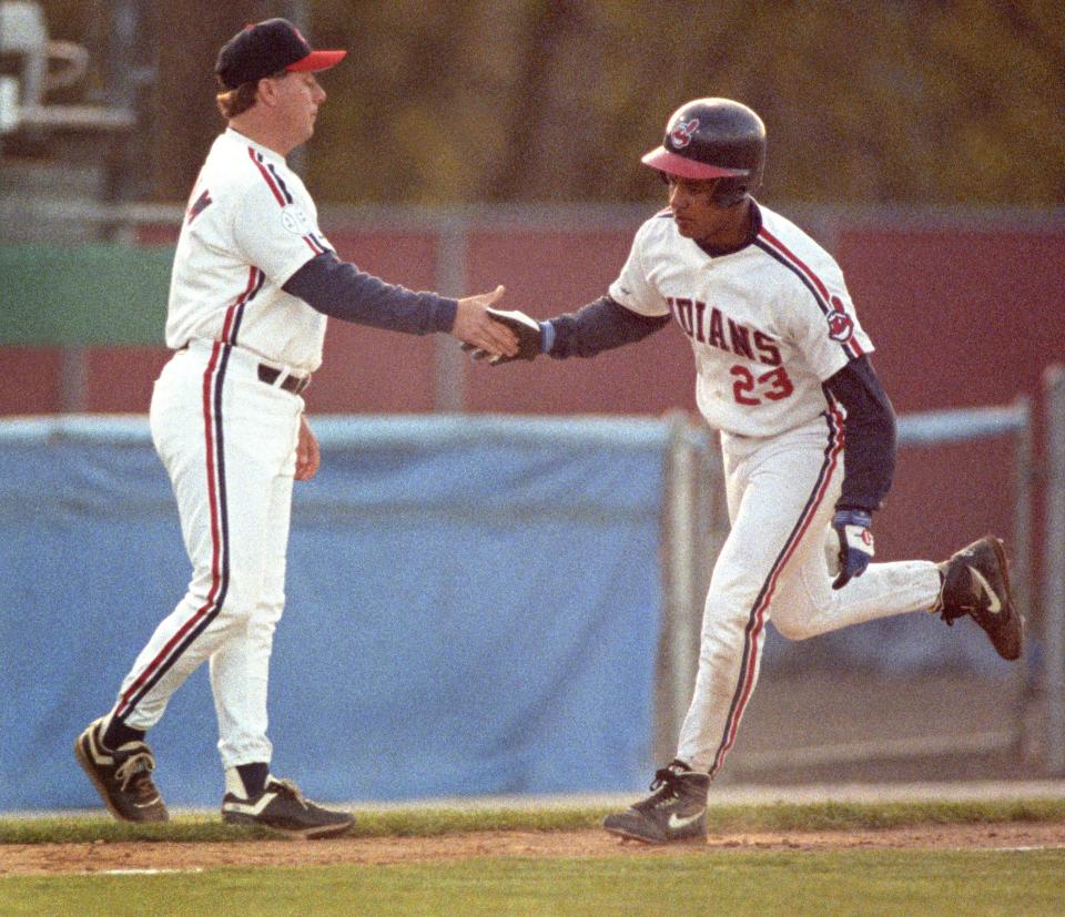 Canton-Akron outfielder Manny Ramirez, right, is congratulated by manager Brian Graham following his solo home run in the third inning against Harrisburg, April 27, 1993 at Thurman Munson Memorial Stadium in Canton. The Senators rallied for a 6-4 win in the game.