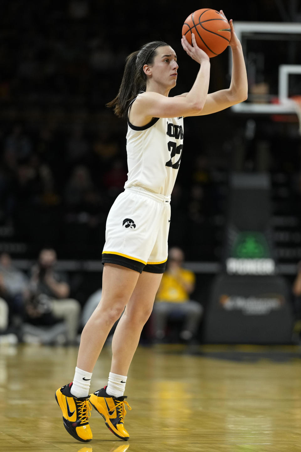 Iowa guard Caitlin Clark (22) shoots a 3-point basket during the first half of an NCAA college basketball game against Bowling Green, Saturday, Dec. 2, 2023, in Iowa City, Iowa. (AP Photo/Charlie Neibergall)