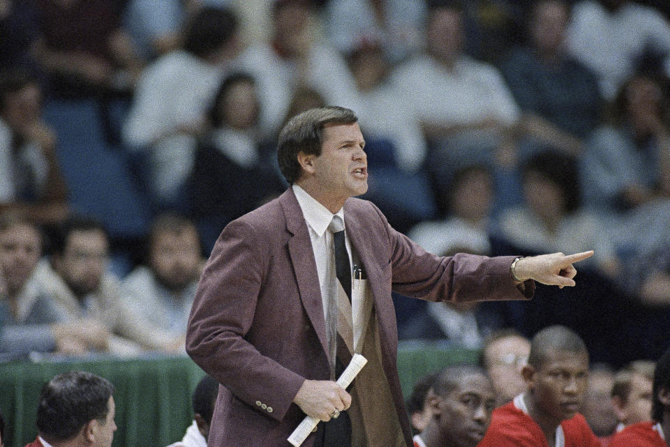 FILE - Louisville coach Denny Crum yells from the sideline during the first half of an NCAA college basketball semifinal game against LSU at Reunion Arena, Saturday, March 29, 1986, Dallas, Texas. Denny Crum, who won two NCAA men’s basketball championships and built Louisville into one of the 1980s’ dominant programs during a Hall of Fame coaching career, died Tuesday, May 9, 2023. He was 86. (AP Photo/David Longstreath, File)