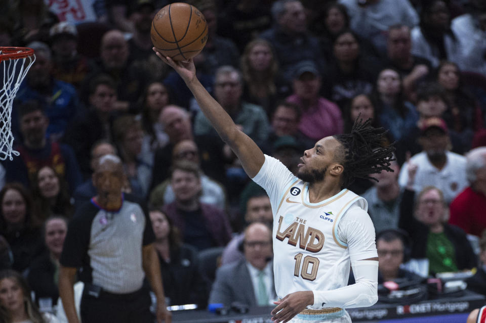 Cleveland Cavaliers' Darius Garland (10) scores on a layup against the Washington Wizards during the second half of an NBA basketball game in Cleveland, Friday, March 17, 2023. (AP Photo/Phil Long)