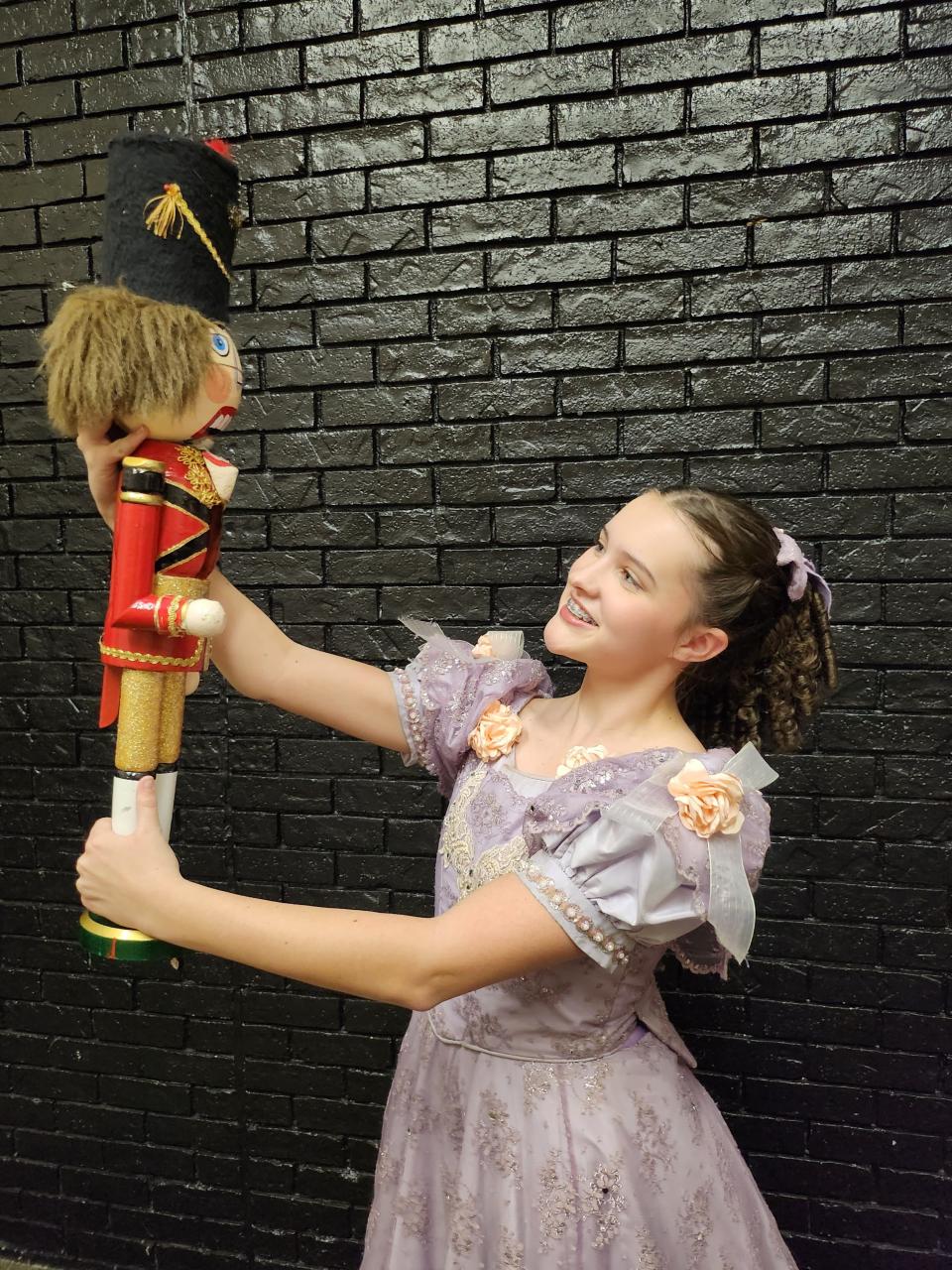 Gracie Vermedahl portraying Clara poses with a Nutcracker as the Lone Star Ballet prepares for its upcoming production of the story of "The Nutcracker," Dec. 8-10 at the Amarillo Civic Center Auditorium.