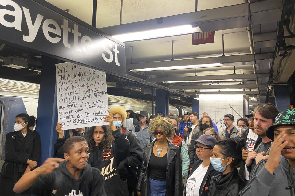 Protesters march through the Broadway-Lafayette subway station to protest the death of Jordan Neely, Wednesday afternoon, May 3, 2023 in New York. Four people were arrested, police said. Neely, a man who was suffering an apparent mental health episode aboard a New York City subway, died this week after being placed in a headlock by a fellow rider on Monday, May 1, according to police officials and video of the encounter. (AP Photo/Jake Offenhartz)