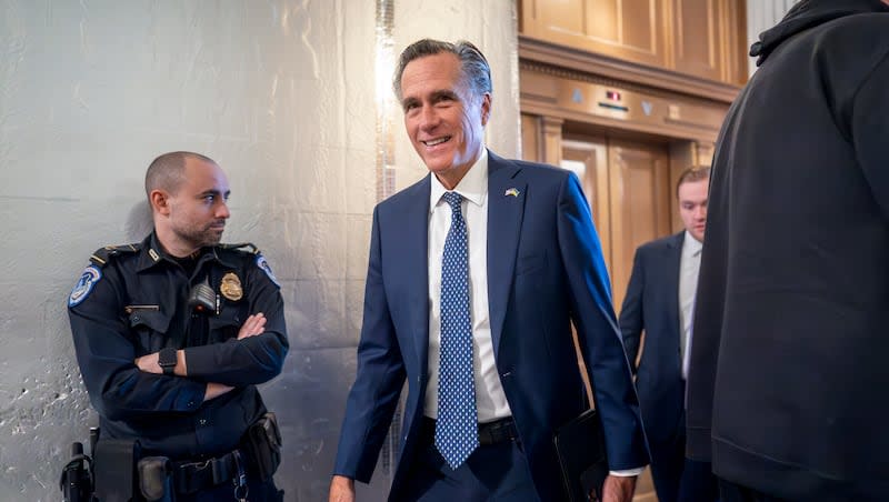 Sen. Mitt Romney, R-Utah, arrives as the Senate prepares a procedural vote on an emergency spending package that would provide military aid to Ukraine and Israel, replenish U.S. weapons systems and provide food, water and other humanitarian aid to civilians in Gaza, at the Capitol in Washington, Sunday, Feb. 11, 2024.