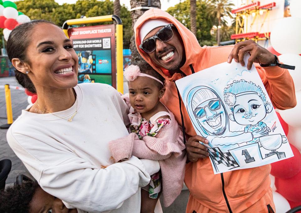 Brittany Bell, Powerful Queen Cannon, and Nick Cannon pose for a photo at LEGOLAND California on May 11, 2022 in Carlsbad, California