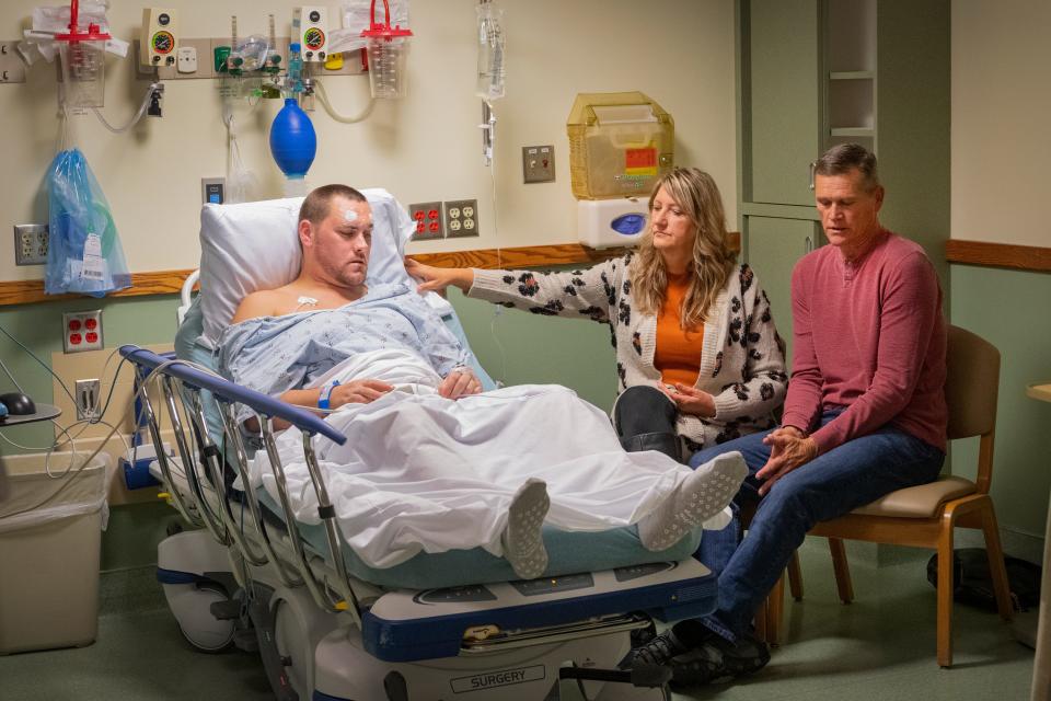 Gerod Buckhalter, DBS patient, shares a moment with his parents, Regina and Rex Buckhalter, before his procedure at J.W. Ruby Memorial.