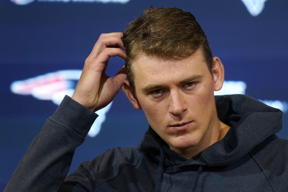 New England Patriots quarterback Mac Jones listens to a question during a media availability after an NFL football game against the New Orleans Saints, Sunday, Oct. 8, 2023, in Foxborough, Mass. (AP Photo/Charles Krupa)