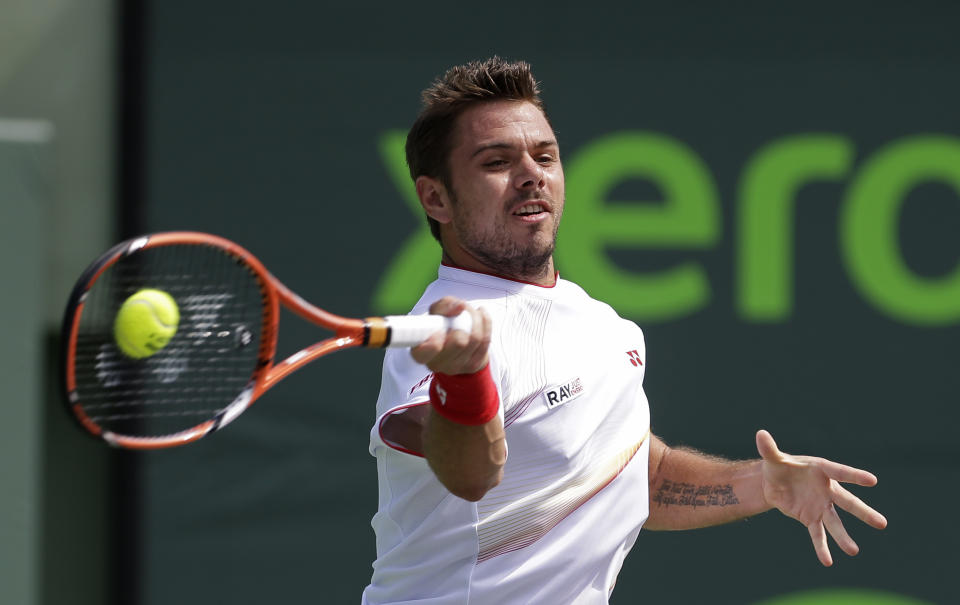 Stanislas Wawrinka, of Switzerland, returns to Daniel Gimeno-Traver, of Spain, at the Sony Open tennis tournament in Key Biscayne, Fla., Saturday, March 22, 2014. (AP Photo/Alan Diaz)