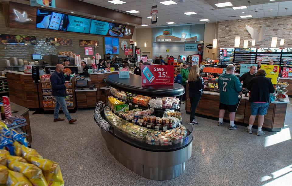 Customers checking out with their purchases at the new Tullytown Wawa on Thursday, April 21, 2022. The convenience store chain plans to offer beer at several of its stores, although Tullytown is not yet on its list.
