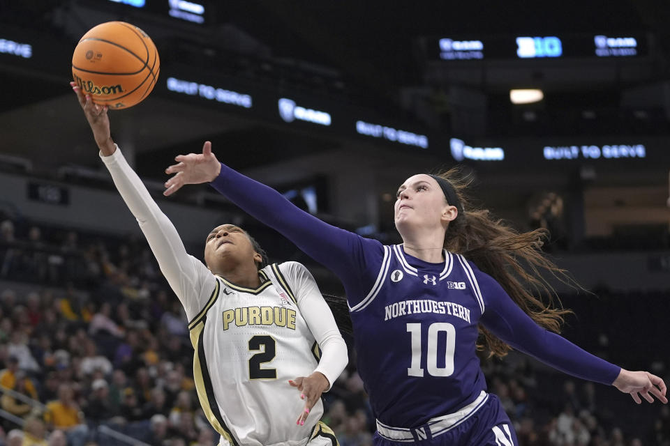 Purdue guard Rashunda Jones (2) shoots against Northwestern forward Caileigh Walsh (10) during the second half of an NCAA college basketball game at the Big Ten women's tournament Wednesday, March 6, 2024, in Minneapolis. (AP Photo/Abbie Parr)