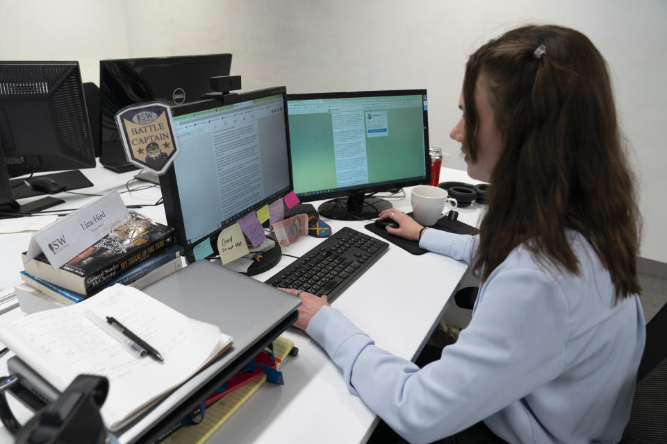 Karolina Hird, a Russia Analyst, works at her desk at the Institute for the Study of War, Wednesday, Jan. 11, 2023, in Washington. (AP Photo/Alex Brandon)