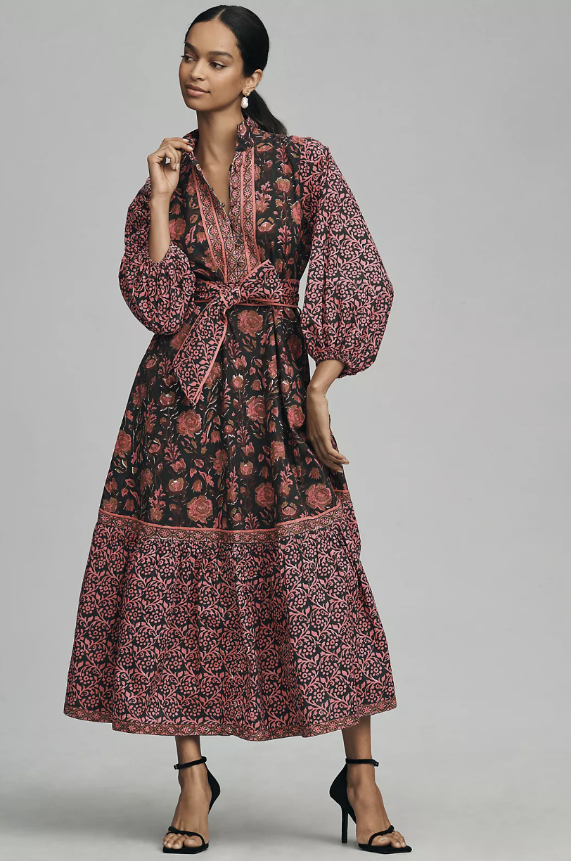 black model wearing black heels and long sleeve pink and brown floral maxi dress, Sue Sartor Athénée Maxi Dress (photo via Anthropologie)