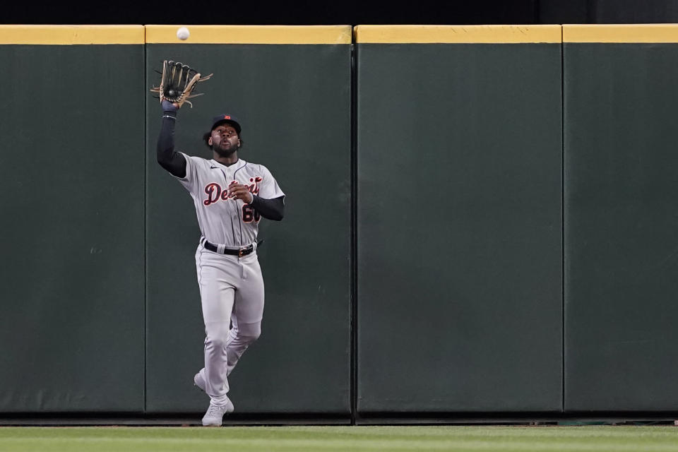 Detroit Tigers center fielder Akil Baddoo catches a deep fly hit by Seattle Mariners' Mitch Haniger during the fourth inning inning of a baseball game Tuesday, May 18, 2021, in Seattle. (AP Photo/Ted S. Warren)