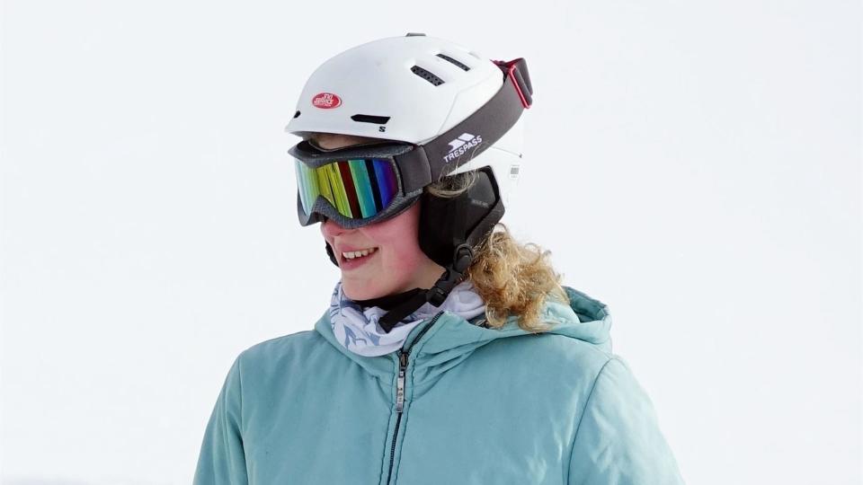 Lady Louise Windsor smiling in a light blue ski jacket