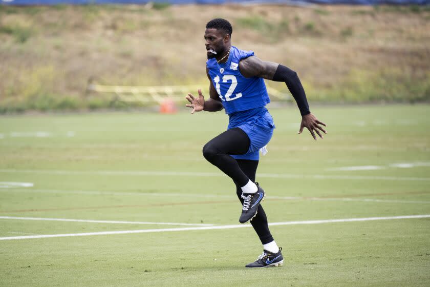 Rams wide receiver Van Jefferson (12) warms up during the NFL football team's camp, Tuesday, June 13, 2023.