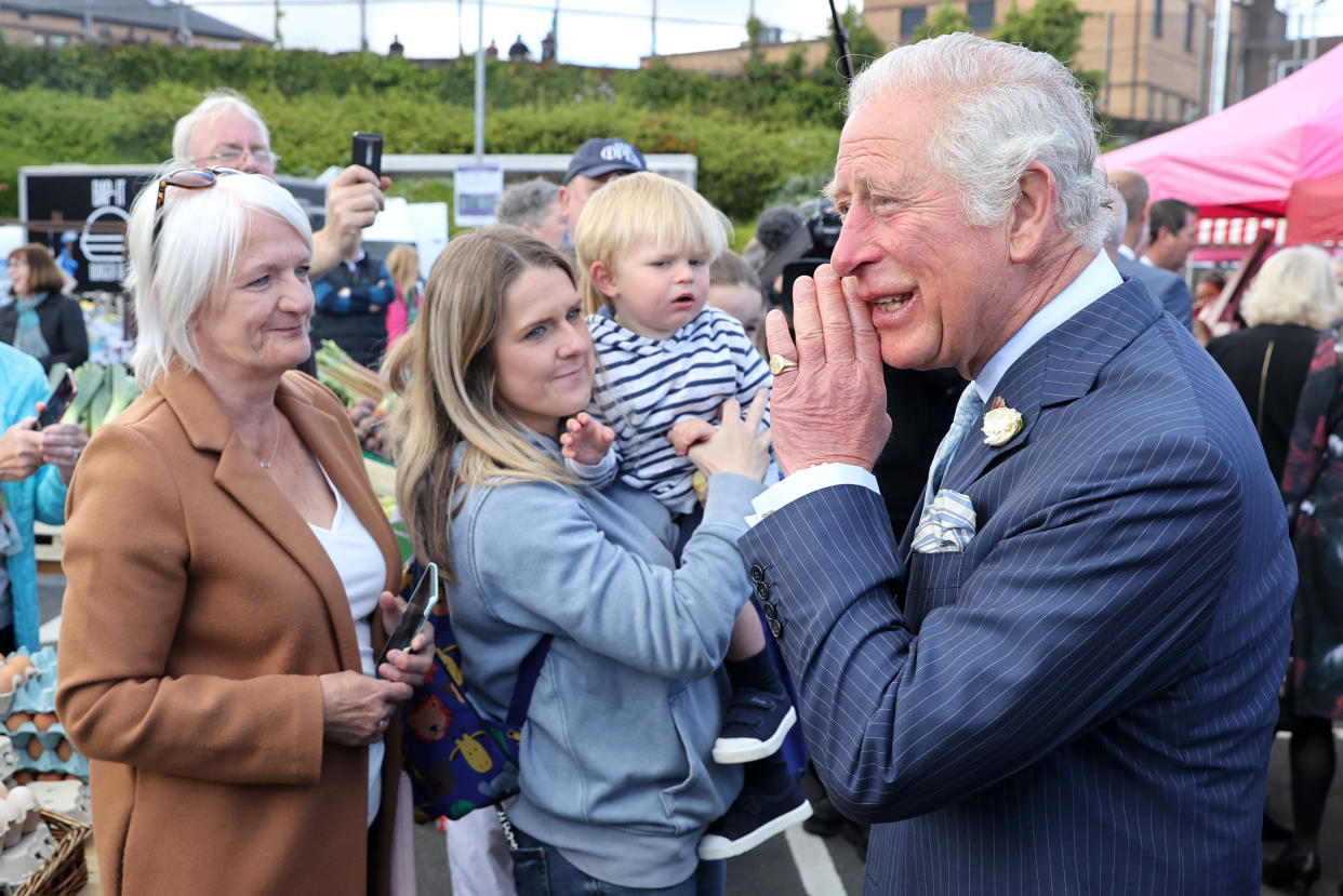 BANGOR, NORTHERN IRELAND - MAY 19: Prince Charles, Prince of Wales speaks with stall holders as he visits Bangor open air market with Camilla, Duchess of Cornwall on May 19, 2021 in Bangor, Northern Ireland. (Photo by Chris Jackson - Pool/Getty Images)