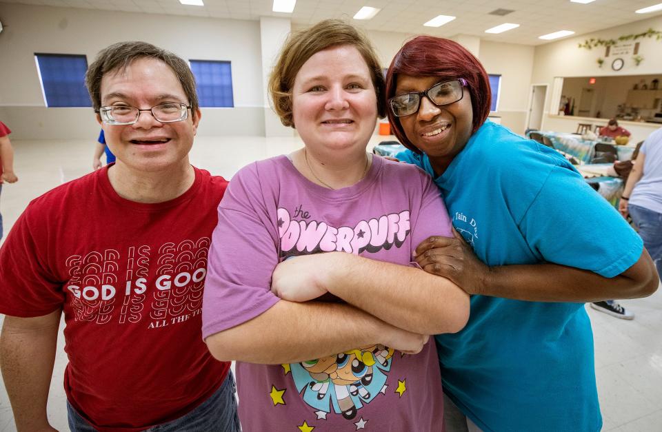 From left, Mike Ortaliz, Hayley Key and Lynette Brown are regular students at Circle Of Friends Ministry in Lake Wales. The nonprofit offers programs for adults with intellectual and developmental disabilities. Circle of Friends moved in May from its longtime location downtown to a former church property.