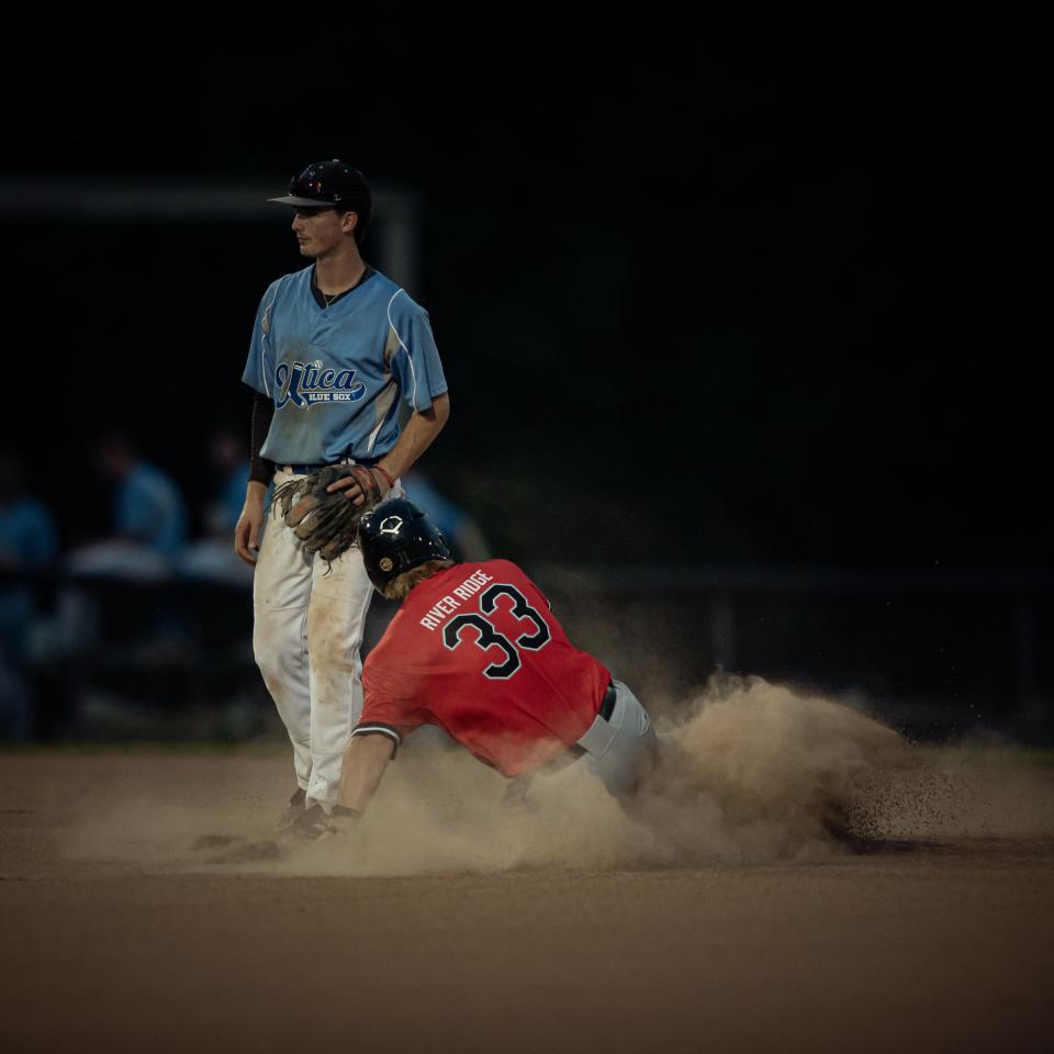 Mark Black safely slides into second for the Amsterdam Mohawks during their game against the Utica Blue Sox at Donovan Stadium in Utica on Friday, July 1, 2022.