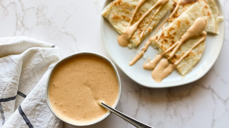 bowl of sauce and quesadilla