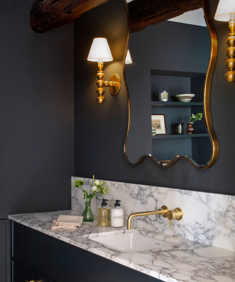 Dark gray powder room with wood beams