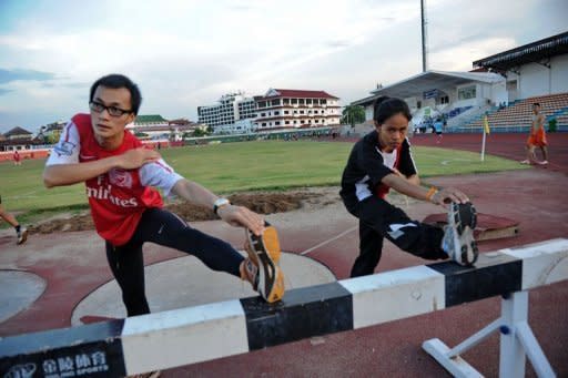 Laotion athletes Kilakone Siphonexay (L) and Lealy Phoukhavont during a training session at the stadium in the Laotian capital Vientiane on May 4. When it comes to the Olympics, there are the strong nations, the less good, the weak and the abject. Communist Laos is in the last category. But with very basic facilities, it's hardly a surprise