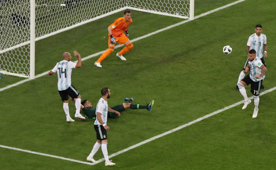<p>Argentina’s Javier Mascherano fouls Nigeria’s Leon Balogun for a penalty </p>