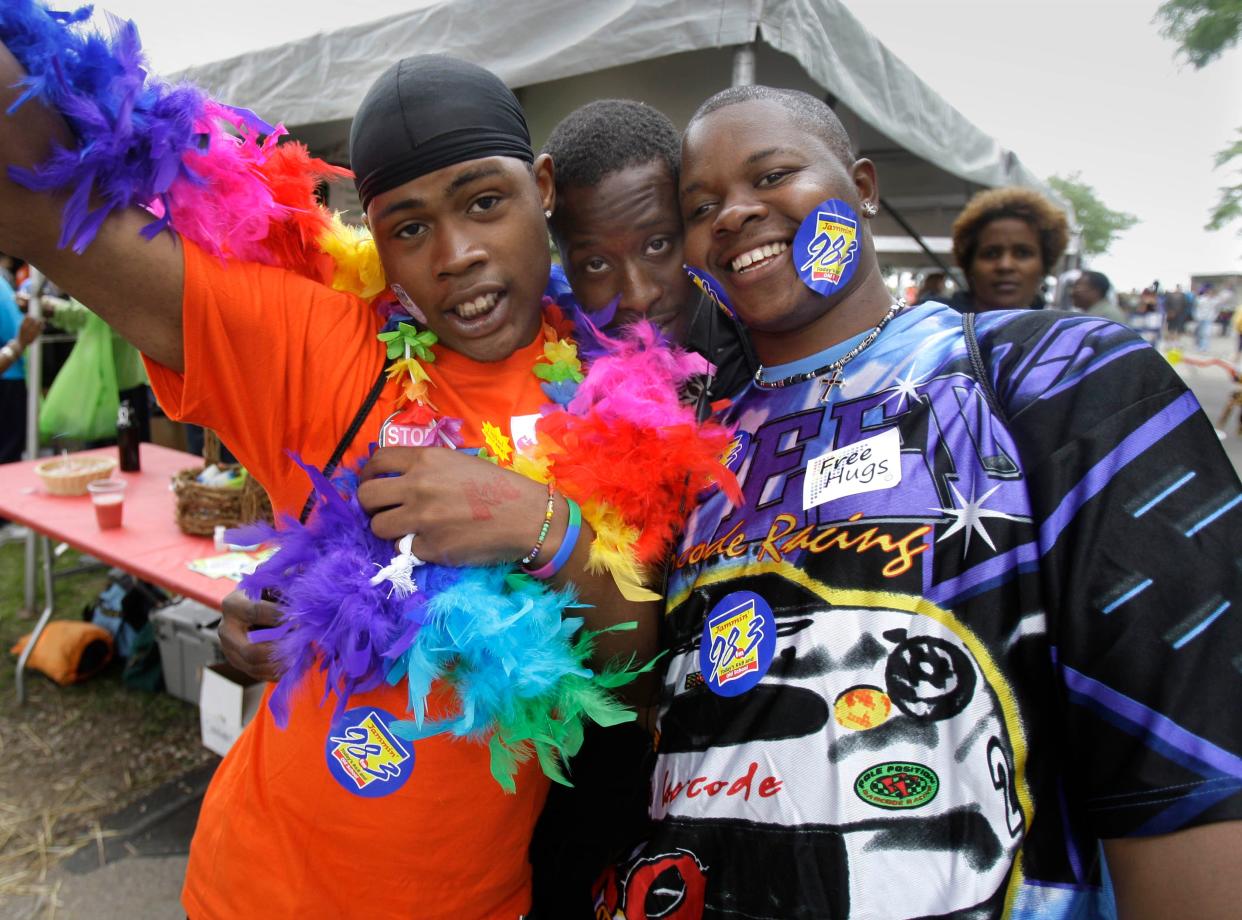 "Be yourself, life life to the fullest," said Martel Willis, left from Milwaukee as he joined friends Montee Travis and Paul Quinn, at Pridefest on June 13, 2010. Willis said it it not easy being Black and gay in Milwaukee but that his family and church support him.