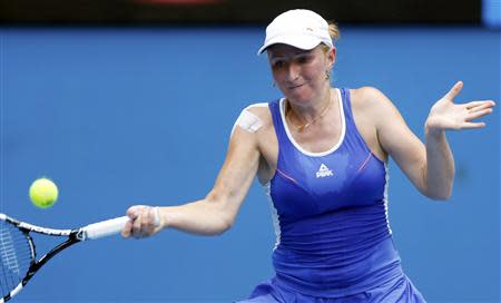 Alla Kudryavtseva of Russia hits a return to Angelique Kerber of Germany during their women's singles match at the Australian Open 2014 tennis tournament in Melbourne January 15, 2014. REUTERS/Brandon Malone