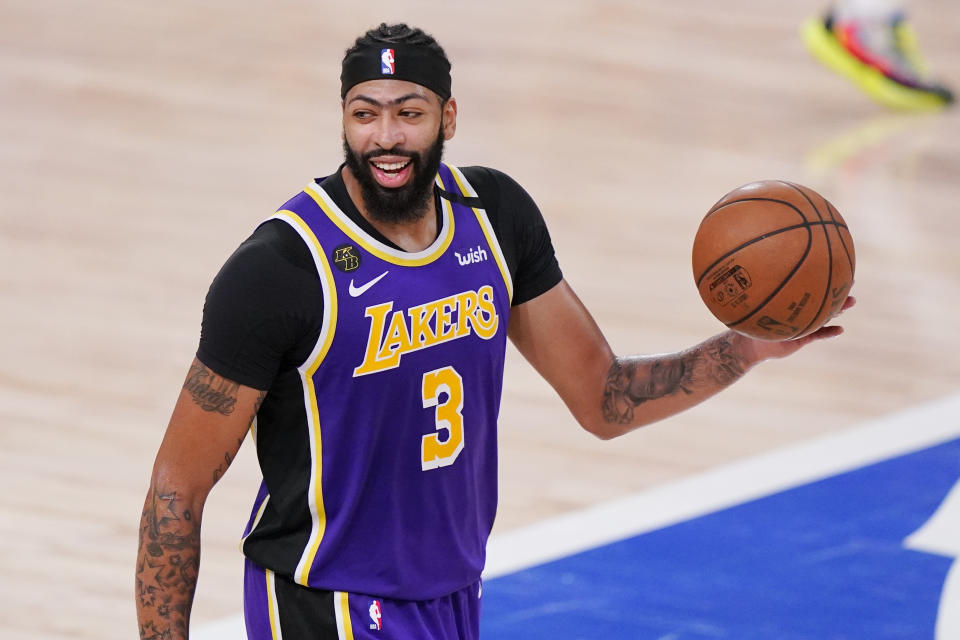 Los Angeles Lakers' Anthony Davis (3) celebrates after the Lakers beat the Denver Nuggets in an NBA conference final playoff basketball game Saturday, Sept. 26, 2020, in Lake Buena Vista, Fla. The Lakers won 117-107 to win the series 4-1. (AP Photo/Mark J. Terrill)