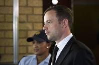 South African Olympic and Paralympic track star Oscar Pistorius arrives at the North Gauteng High Court in Pretoria, September 12, 2014. REUTERS/Rogan Ward