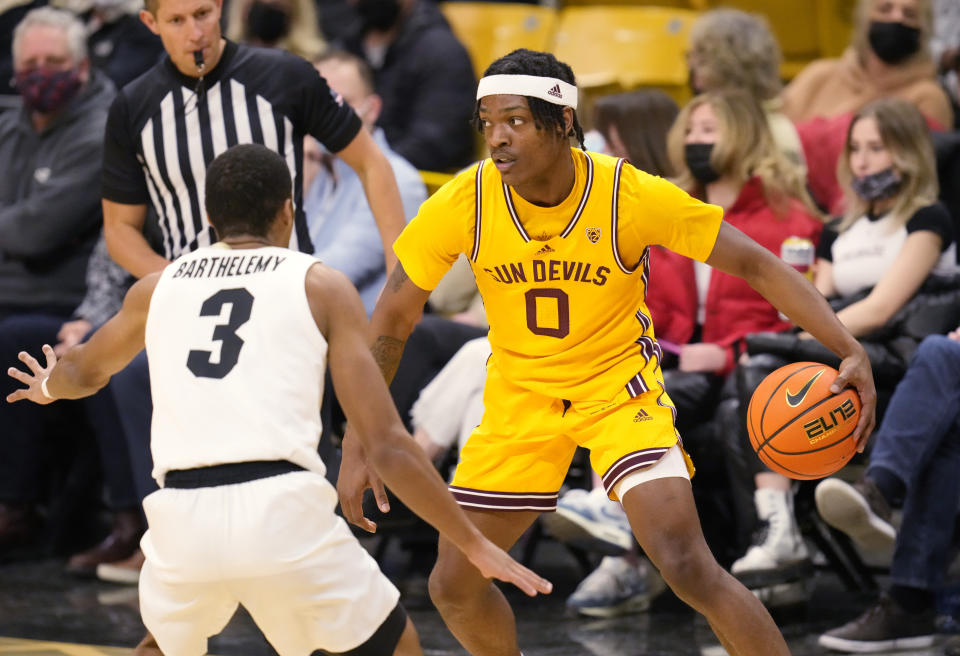 Arizona State guard DJ Horne, right, looks to pass the ball as Colorado guard Keeshawn Barthelemy defends during the first half of an NCAA college basketball game Thursday, Feb. 24, 2022, in Boulder, Colo. (AP Photo/David Zalubowski)