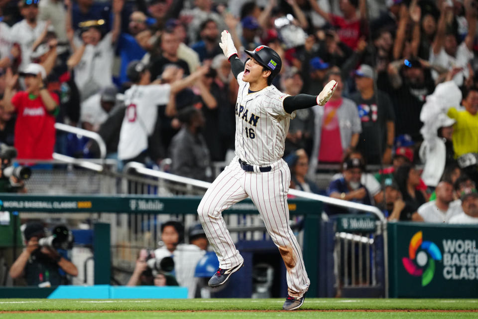 Shohei Ohtani rounds third on a three-run home run hit by Japan teammate Masataka Yoshida against Mexico in Monday's WBC semifinal. (Photo by Mary DeCicco/WBCI/MLB Photos via Getty Images)