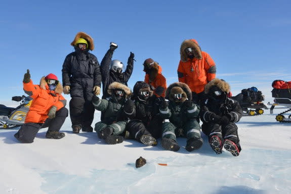 Members of the Belgo-Japanese SAMBA meteorite team members with an 18kg meteorite found during a field trip on the Nansen Ice Field, 140km south of Princess Elisabeth Antarctica, during the BELARE 2012-2013 expedition. (Photo courtesy of International Polar Foundation) <br> <br> <a href="http://www.livescience.com/27550-big-meteorite-found-antarctica.html" rel="nofollow noopener" target="_blank" data-ylk="slk:Click here to see the full collection at LiveScience.com;elm:context_link;itc:0;sec:content-canvas" class="link ">Click here to see the full collection at LiveScience.com</a>