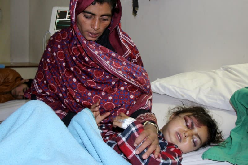 FILE PHOTO: Six-year-old Safia Bibi, who was rescued after heavy snowfall and avalanches receives medical treatment at a hospital in Muzaffarabad
