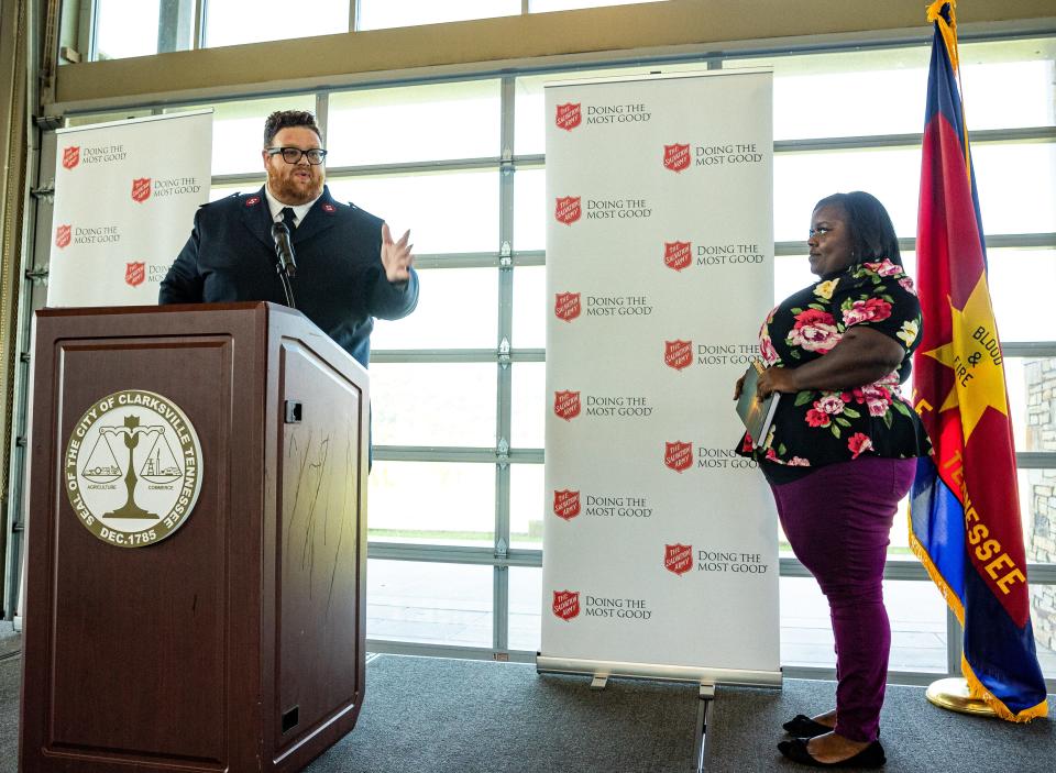 Salvation Army corps officer Lt. Andrew Lewis introduces Berlisha Jarrett, a graduate of the Salvation Army's LIFNav program during the Champions of Hope luncheon at the Wilma Rudolph Event Center in Clarksville, Tenn. on Sep. 15, 2022.